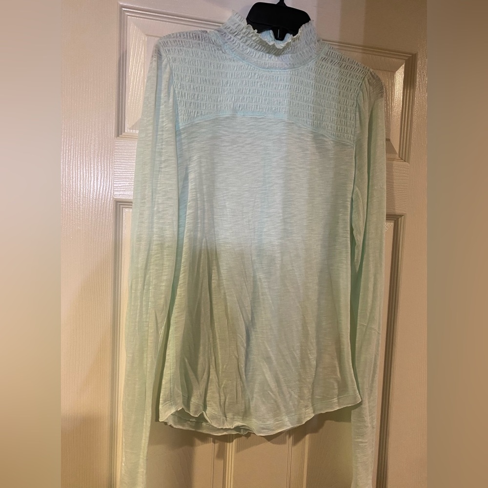 Free people top. Never worn. New without tags